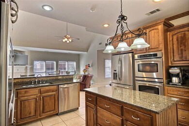 Large gourmet kitchen with island, granite, stainl