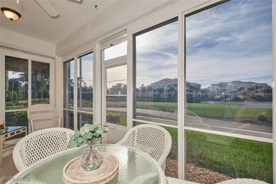 Sunroom with ceiling fan and a water view