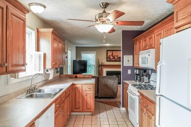 Fully applianced galley kitchen with nice cabinet 