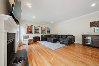 Ample sized family room with gas fireplace and sliders to deck