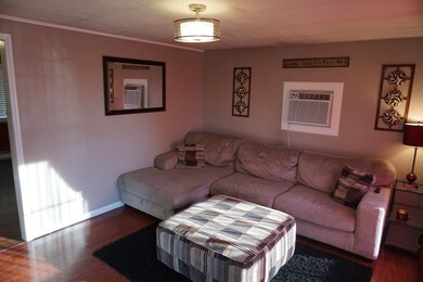 Spacious living room area with picture window and 
