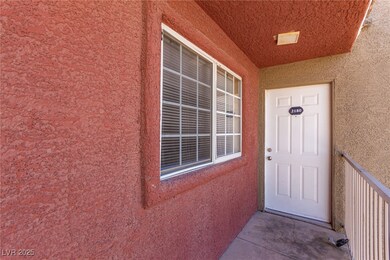 Doorway to property featuring stucco siding