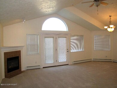 Living room with cathedral ceiling.