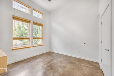 Spare room featuring a wealth of natural light, c