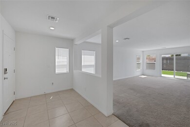 Spare room with baseboards, recessed lighting, lig