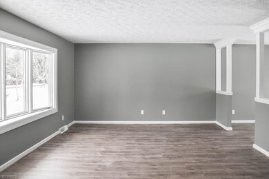 Spacious living room with a bay window and beautif