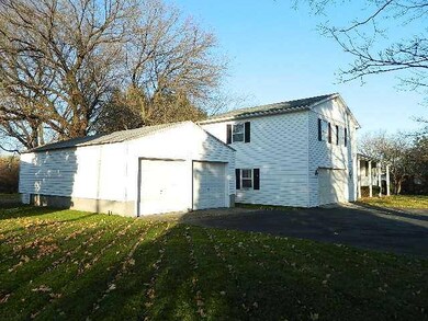 Exterior Front. There are four garage spaces with 