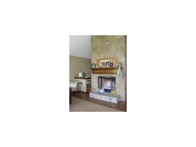 stone fireplace in Living Room