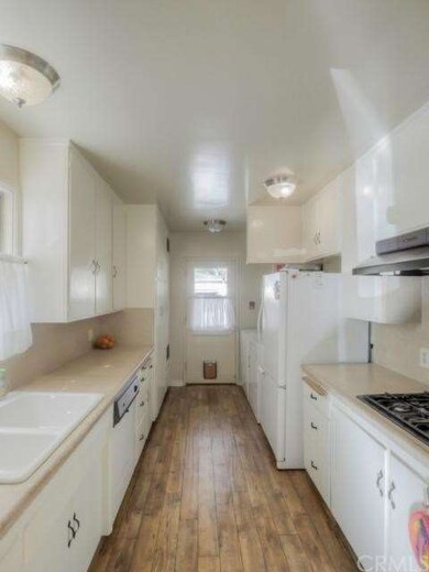  See the washer, dryer and frig on the right near 