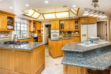 Oversized Family Kitchen wit Granite Counter Tops, Center Island and Breakfast Bar