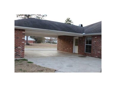 Other. Attached 2 car carport with storage.