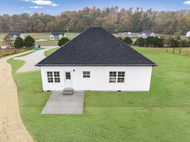 CONCRETE BACK PATIO .. door is next to kitchen.. perfect for grilling!!!!