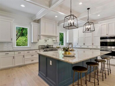 Kitchen featuring plenty of natural light, stainle