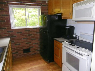 Kitchen has electric stove.