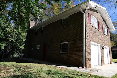 View of side of home with a garage