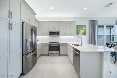 Kitchen featuring stainless steel appliances, sink