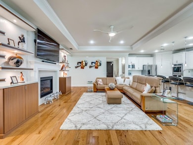 Living room with light wood-type flooring, a tray 