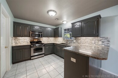 Wonderfully remodeled kitchen with granite.