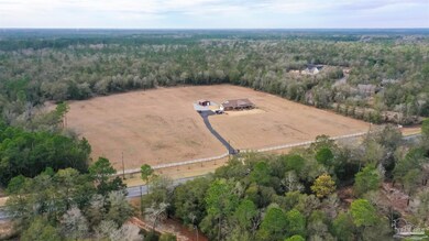 The 55 acre flat land is left of Drive