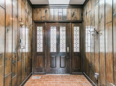 Large Entry Hall with Rich Wood & Skylight above D