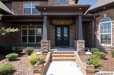 Deep covered front porch is just the place to sit down with a glass of iced tea.