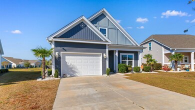 View of front of property featuring a garage and a