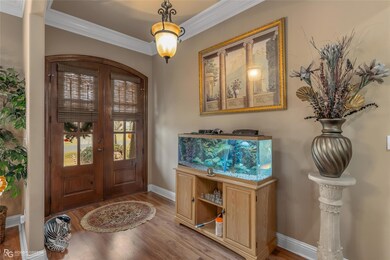 Entrance foyer with hardwood / wood-style flooring