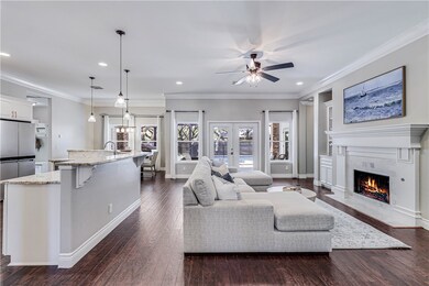 Featuring elegant crown molding throughout, this h