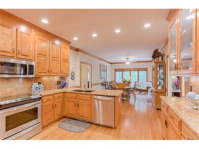 Gourmet Kitchen has Granite Counters with Bar Seat