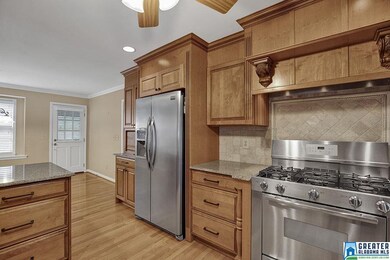 Kitchen features granite countertops,  stainless s