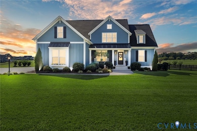 View of front facade featuring a standing seam roof, a porch, and a metal roof