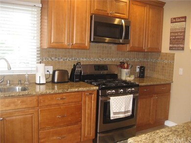 REMODELED KITCHEN WITH STAINLESS STEEL APPLIANCES