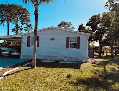 View of side of property featuring central AC, a y