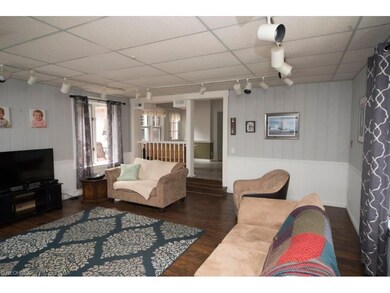 Great room with wainscoting.