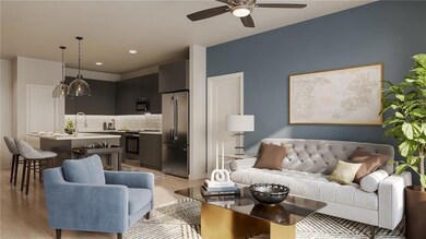 Living room featuring ceiling fan, sink, and light