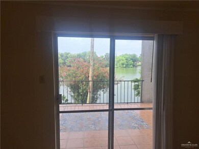 Entryway featuring a water view and tile patterned flooring
