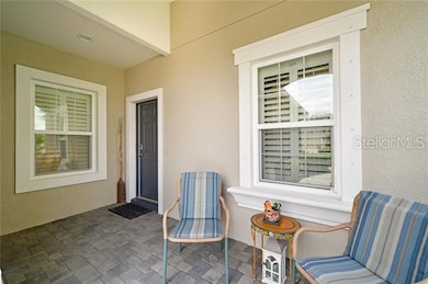 Covered front porch with pavers eading to the fron
