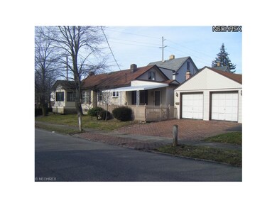 View from Lowell Ave shows the length of the house.