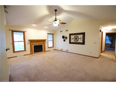 Spacious living room with vaulted ceilings and gre
