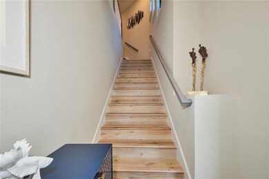Stairs with hardwood / wood-style flooring