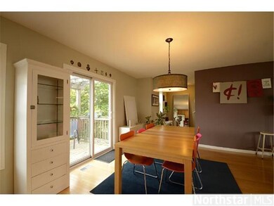 Dining rooms opens to large deck and pergola.