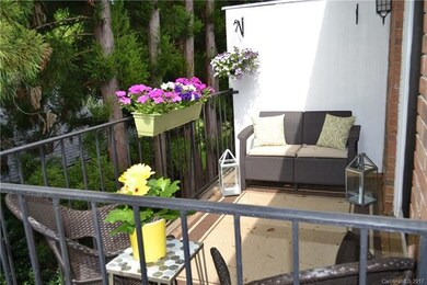 Semi private balcony features enough room for a co