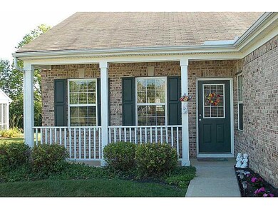 Exterior Front. Charming front porch accents the front of this beautiful condo!
