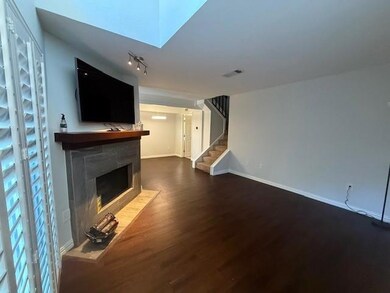 Unfurnished living room with a tiled fireplace and