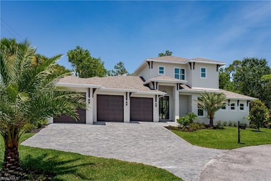 View of front of house with an attached garage, a front yard, decorative driveway, stucco siding, and a shingled roof