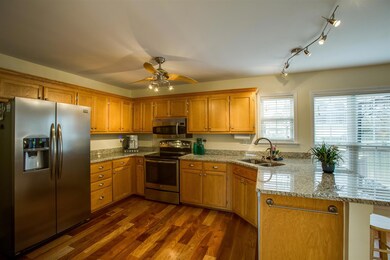 Stainless appliances and updated granite countertops. Refrigerator to remain with property.