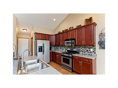 Kitchen. Maple cabinets with cranberry stain