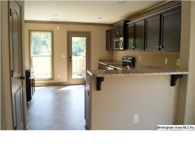 Breakfast bar between dining room and kitchen