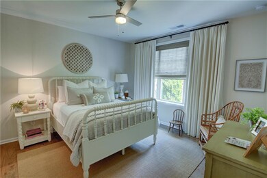 Bedroom featuring wood finished floors, visible ve