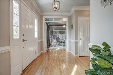 Note the beautiful moldings, lighting, French door